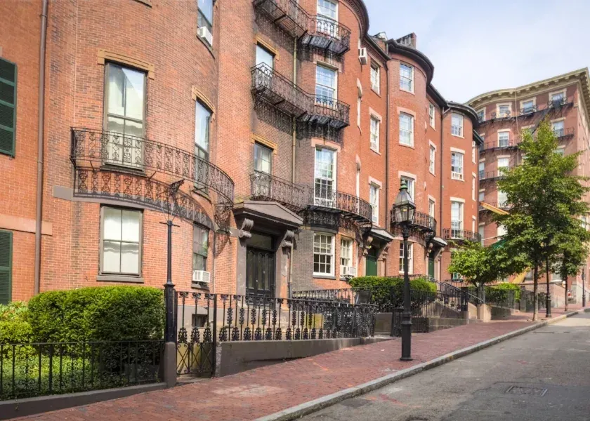 Period balconies and ironwork on a restored brownstone