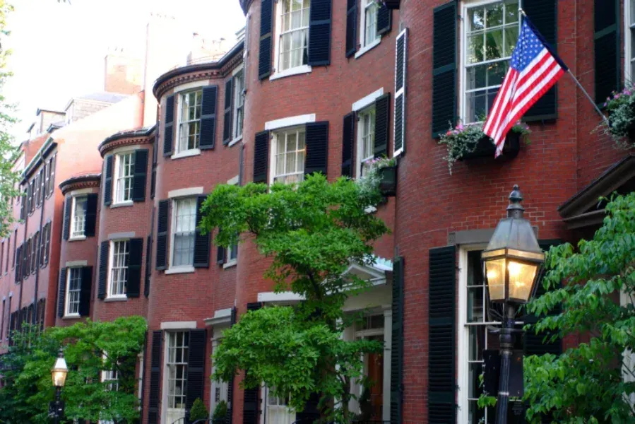 Restored brownstone row houses on a Boston street