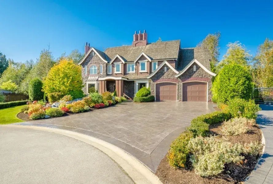 New home with a landscaped driveway approach