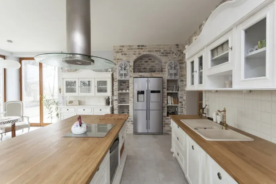 Kitchen remodel with a stone range hood